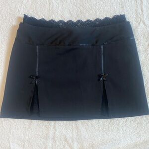 Black mini skirt with cute lace trim.